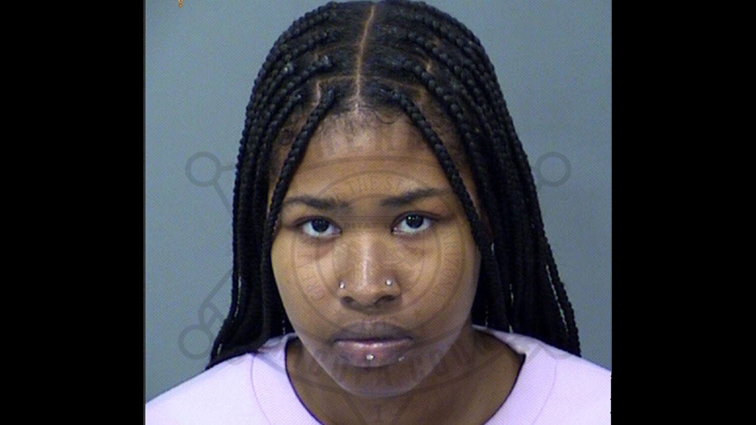 Sharde Booker, a teacher's aide, is accused of threatening to shoot up Westpark Elementary School i...