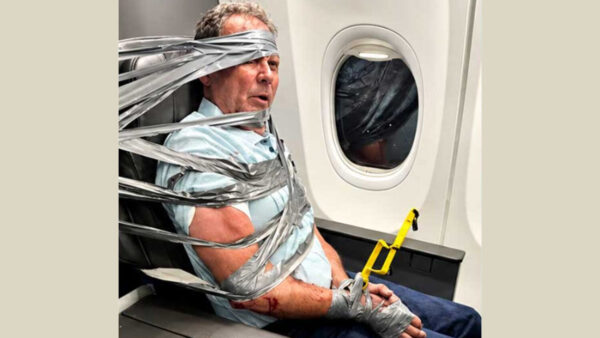 A passenger from Arizona was subdued with duct tape and zip ties during a wild scene aboard an American Airlines flight last week. (Photo by Richard O'Lenick via gunforhire.com)