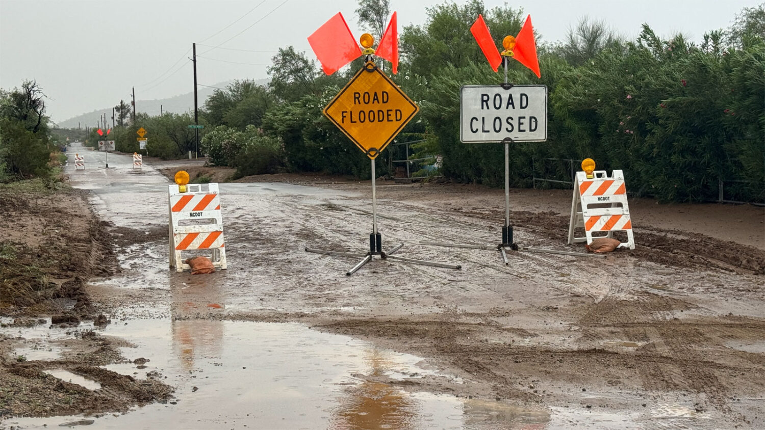 Widespread thunderstorms flooded north Valley roadways on Tuesday morning. (KTAR News photo/Colton ...