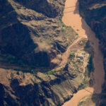 Bright Angel Canyon, damaged by flash floods, runs into the Colorado River in the Grand Canyon. (AP Photo/John Locher)