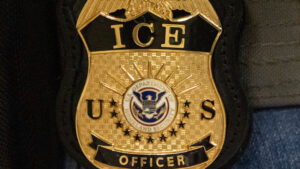 AP Source: ICE officer charged with lying about shooting of Venezuelan man