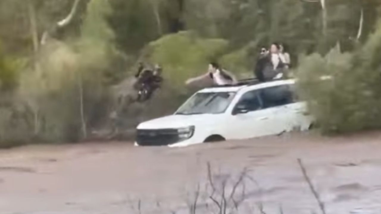 Deputies rescued four people from the roof of a car that was swept away by flash flooding in Yavapa...