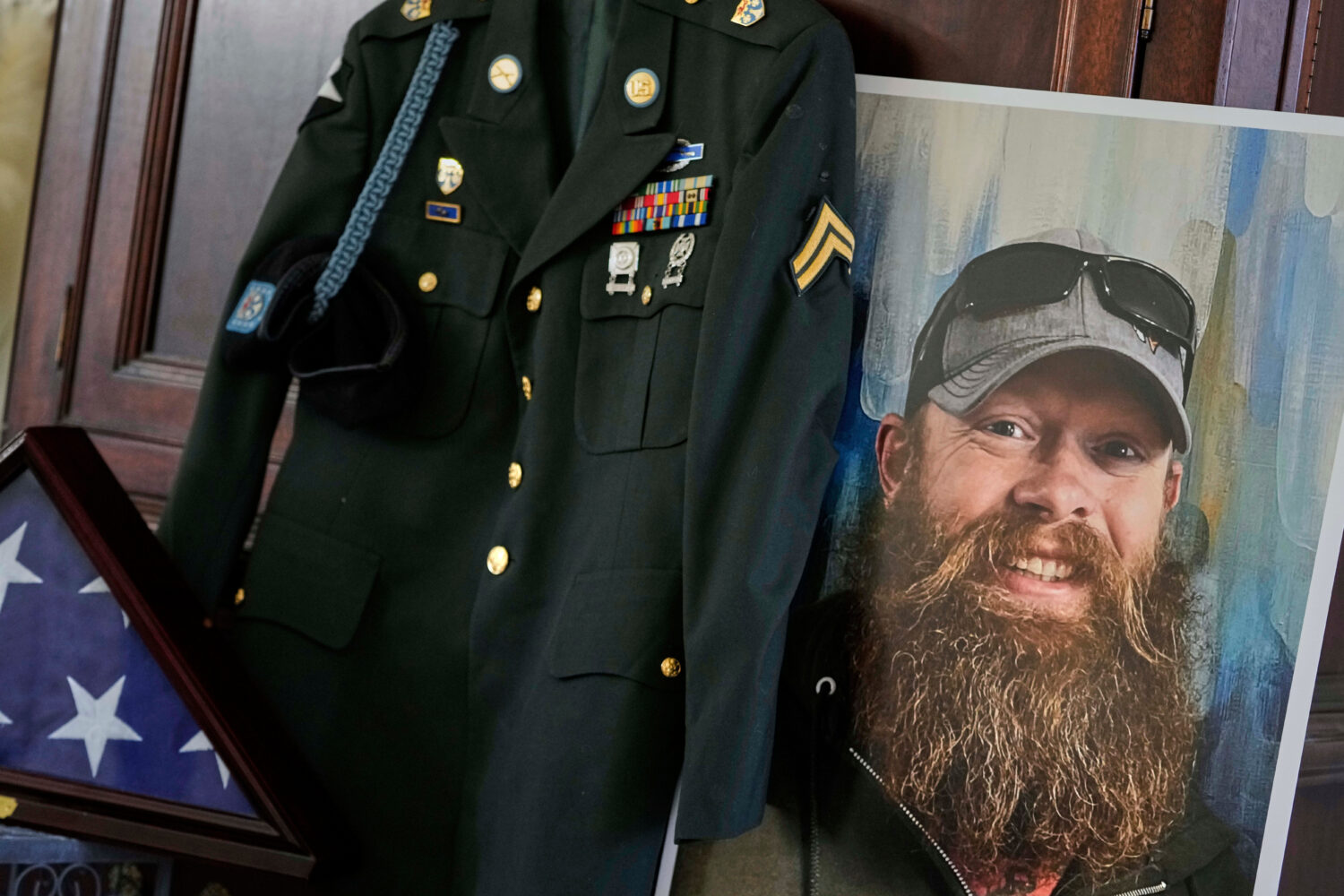 FILE - The Army dress uniform and photo of the late Christopher Pelkey is displayed at his mother's...
