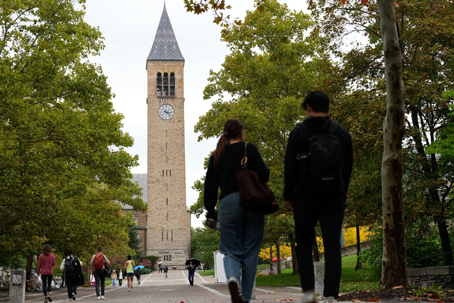 Pedestrians walk on the campus at Cornell University in Ithaca, N.Y., Thursday, Oct. 1, 2026. (AP P...