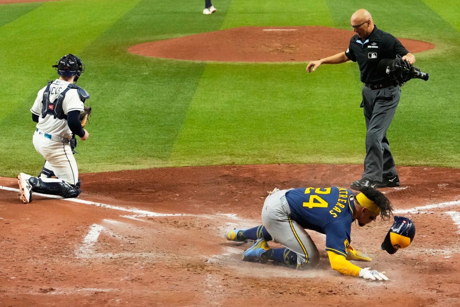 Milwaukee Brewers' William Contreras celebrates after scoring during the sixth inning of Game 5 of ...