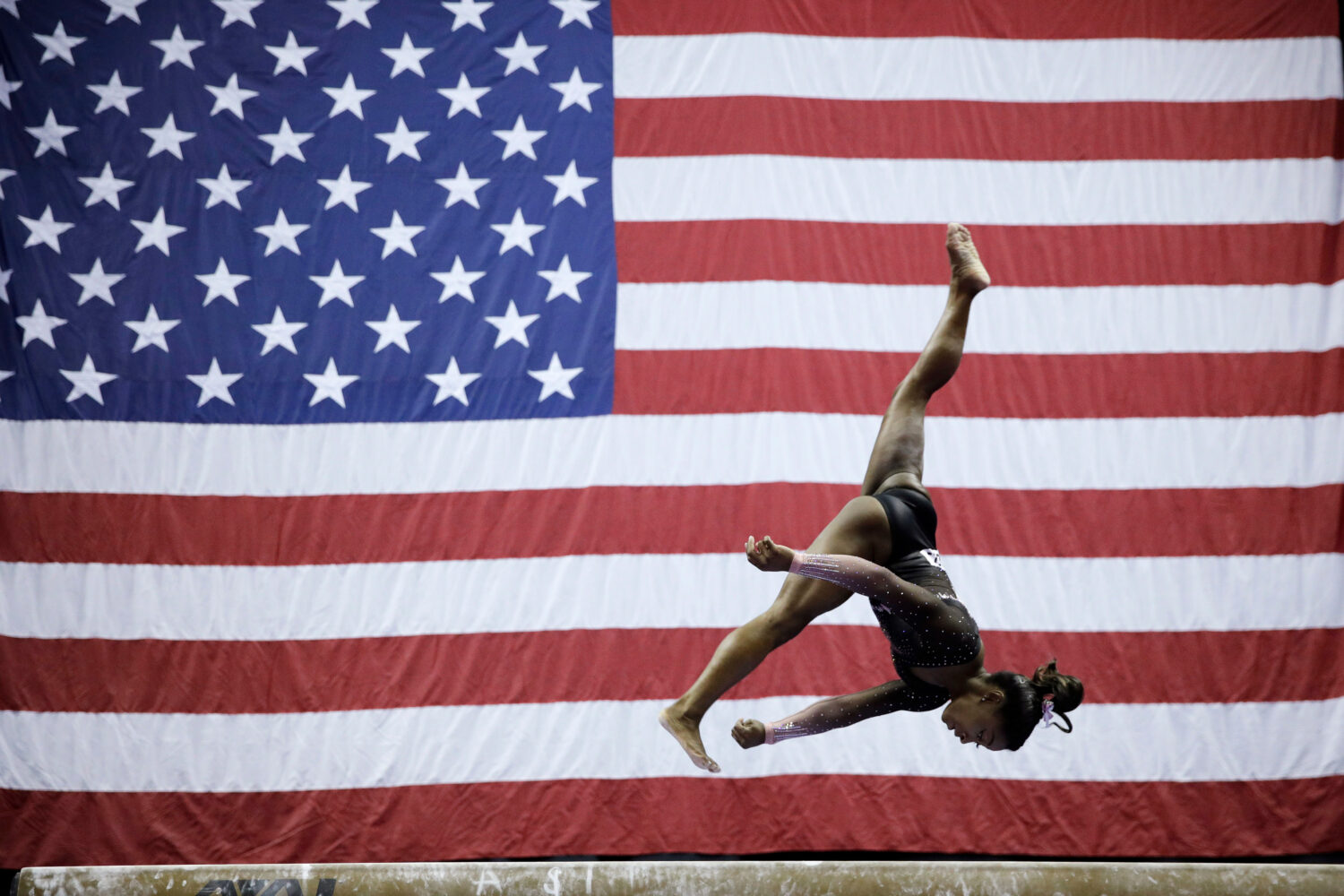 FILE - Simone Biles competes in the beam during the senior women's competition at the 2019 U.S. Gym...