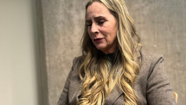 This photo made with a smartphone shows Bernadette Greene-Placentia, who is running for congress in Arizona's 8th Congressional District speaking during an interview with The Associated Press in Phoenix, Thursday, Oct. 8, 2026. (AP Photo/Wufei Yu)