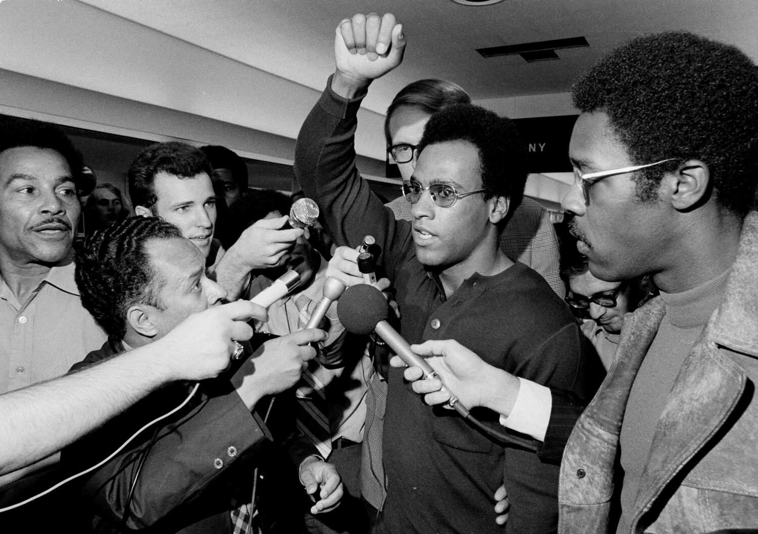 FILE - Huey Newton, Black Panther Party minister of defense, raises his arm as he is surrounded by ...