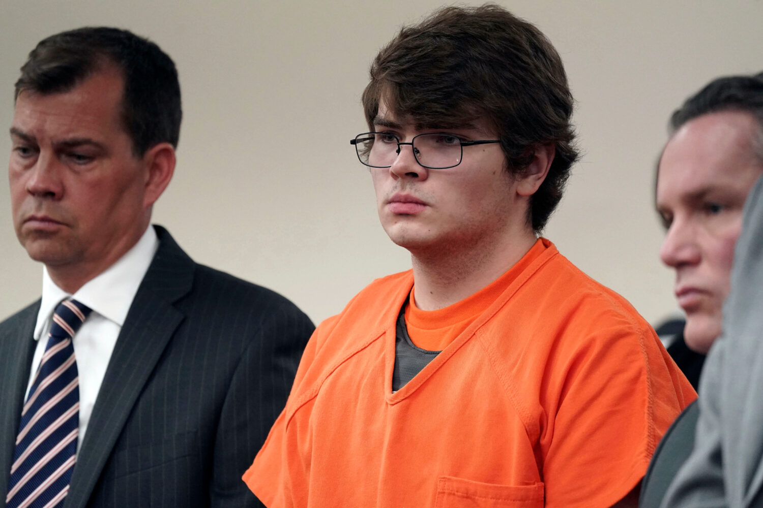 FILE - Payton Gendron, center, listens as he is sentenced, Feb 15, 2023, in Buffalo, N.Y. (Derek Ge...