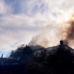 Fire crews battle Southern California blaze that burned 6 homes, led to the evacuation of 16,000