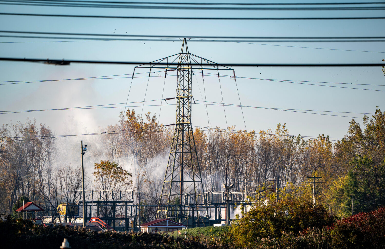 A plume of smokes rises from MC Tank Transport Inc., where a chemical tank exploded overnight, prom...