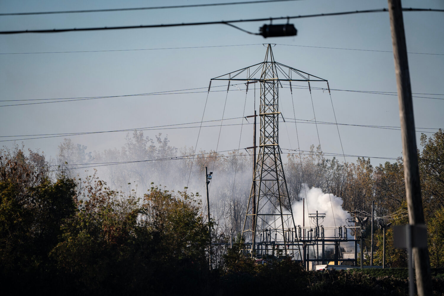 A plume of smokes rises from MC Tank Transport Inc., where a chemical tank exploded overnight, prom...