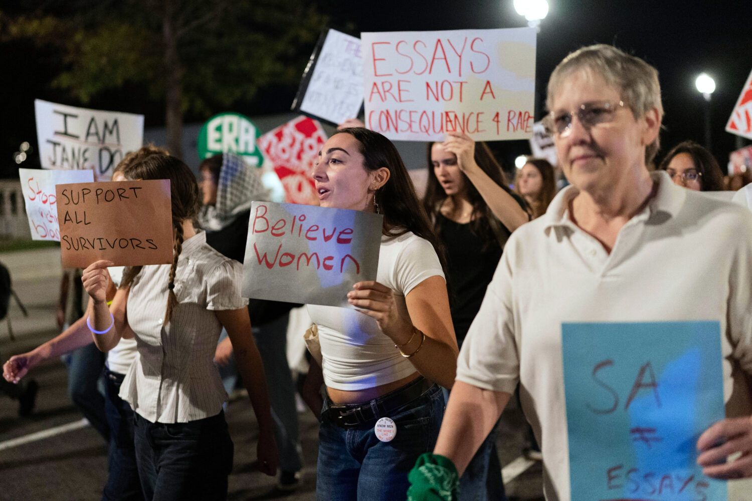 Demonstrators march from the Washington Monument to the White House during a "Stop Sexual Violence"...