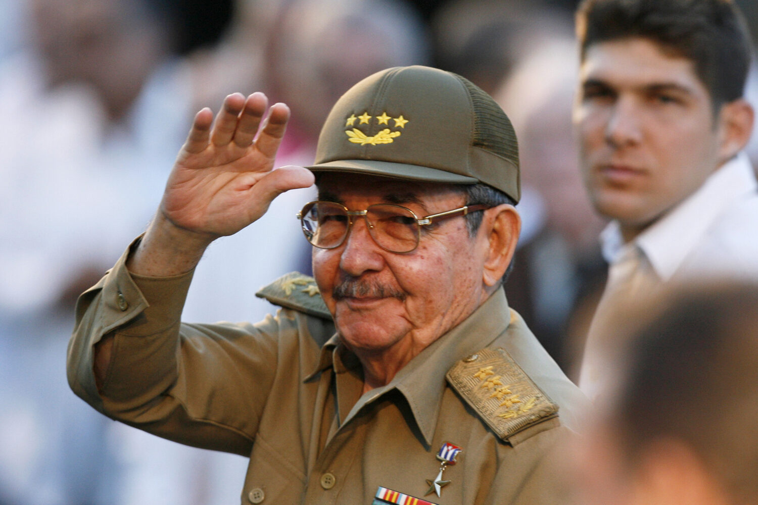 FILE - Cuba's acting President Raul Castro waves to journalists in front the Museum of the Revoluti...