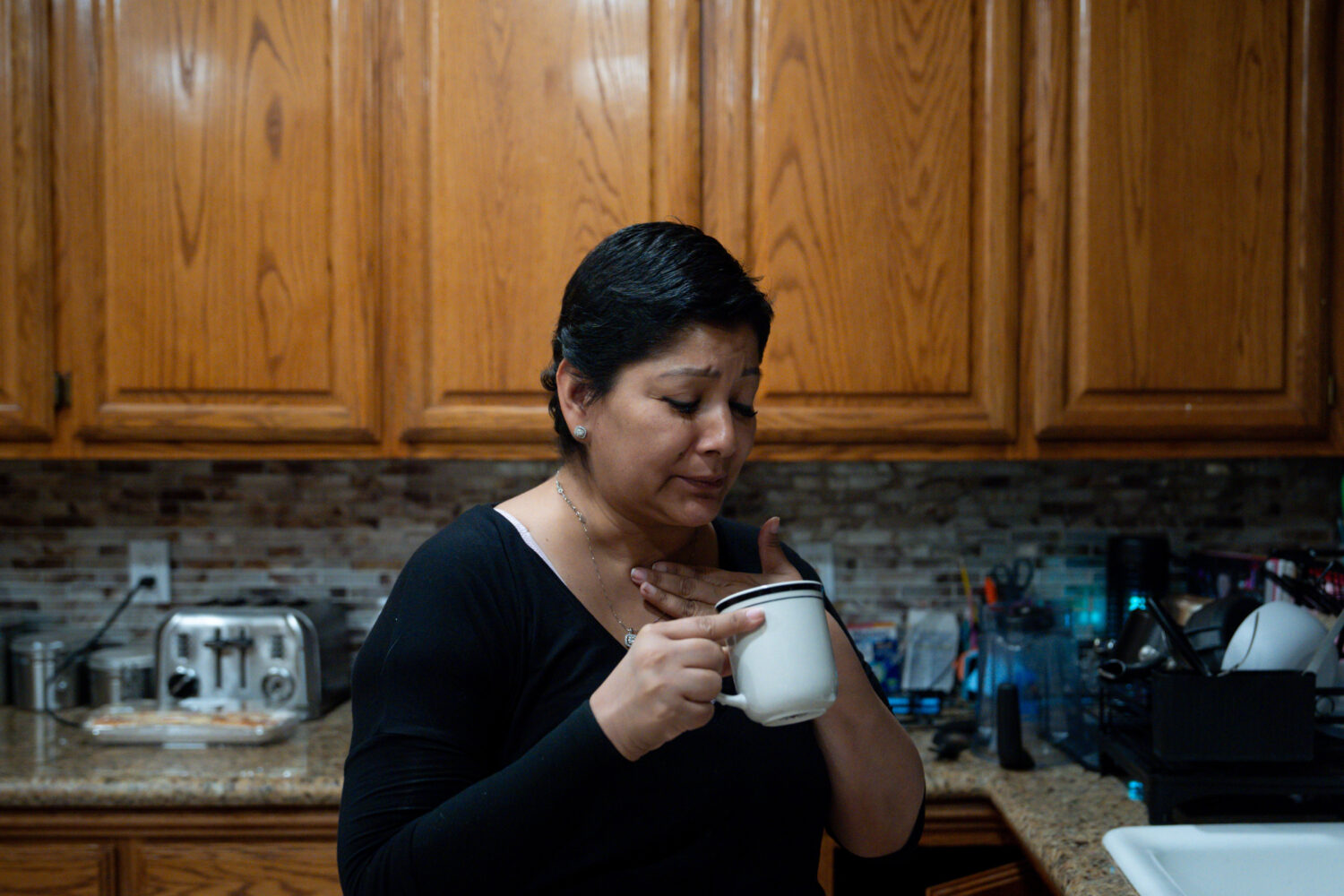 Cindy Banda drinks a home remedy after experiencing side effects from the targeted therapy pill Kis...