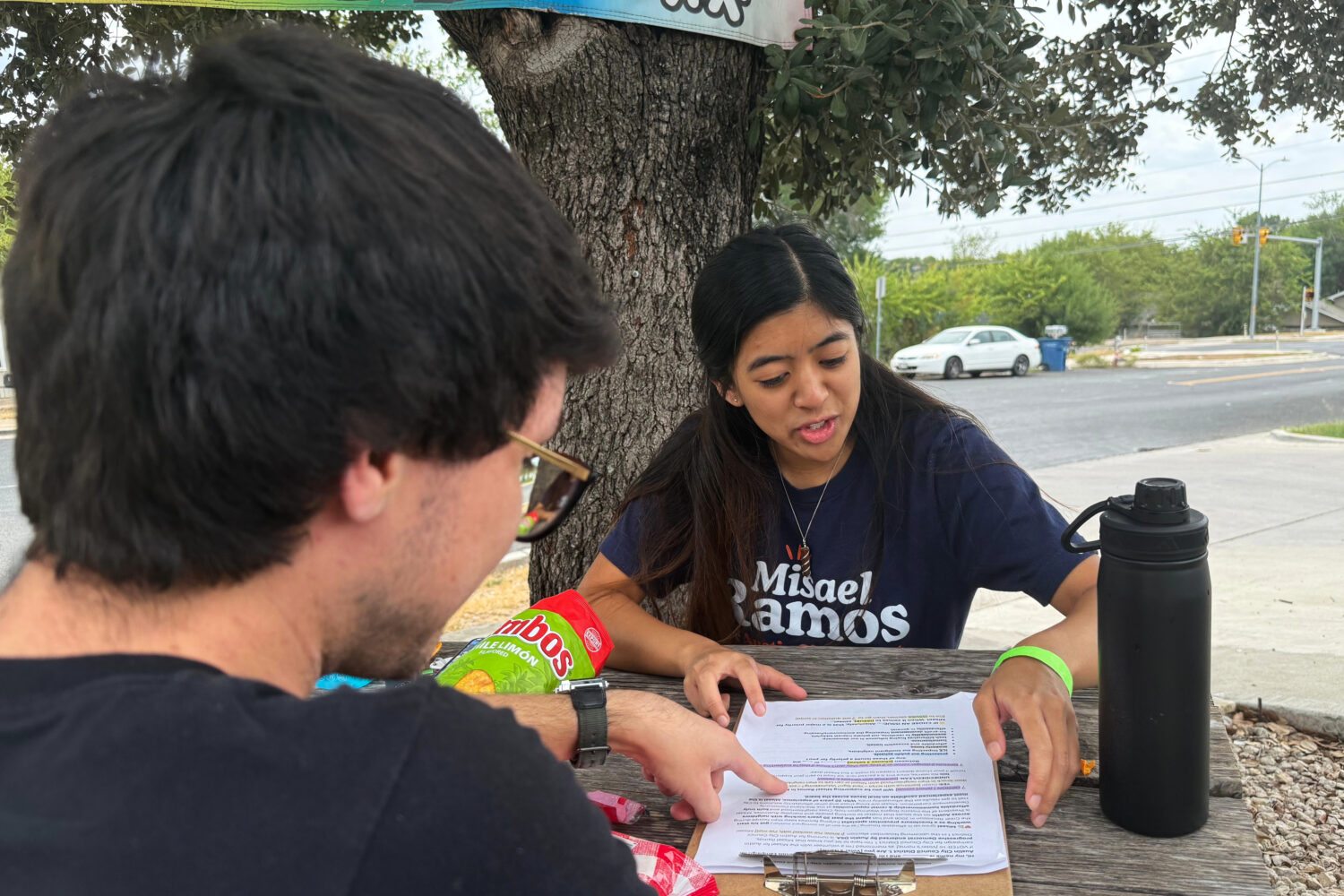This photo taken with a smartphone shows two members of the Democratic Socialists of America, Mark ...