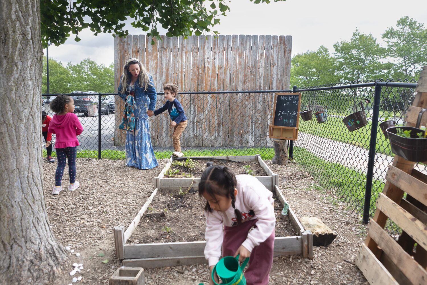 FILE - Diana McGuire leads her 4-year-old son Noah by the hand across the playground at St. Mary's ...