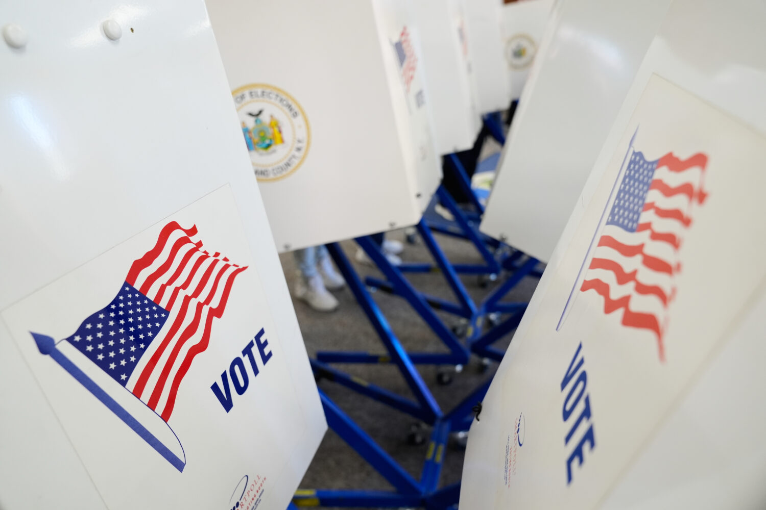 Voters use privacy booths to fill out their ballots at an early voting site in Haverstraw, N.Y., Mo...