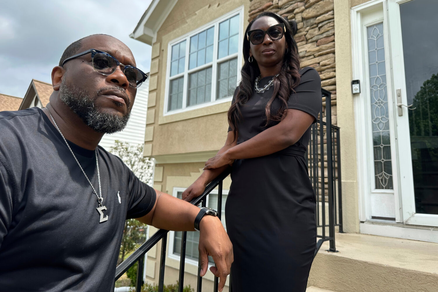FILE - Toi Cliatt, left, and Trina Martin stand outside the home, which in 2017 the FBI mistakenly ...