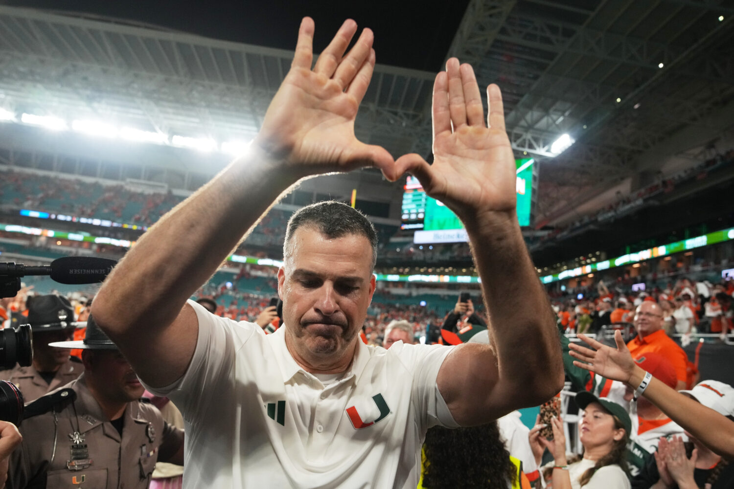 Miami head coach Mario Cristobal celebrates after Miami defeated Florida State in double overtime o...
