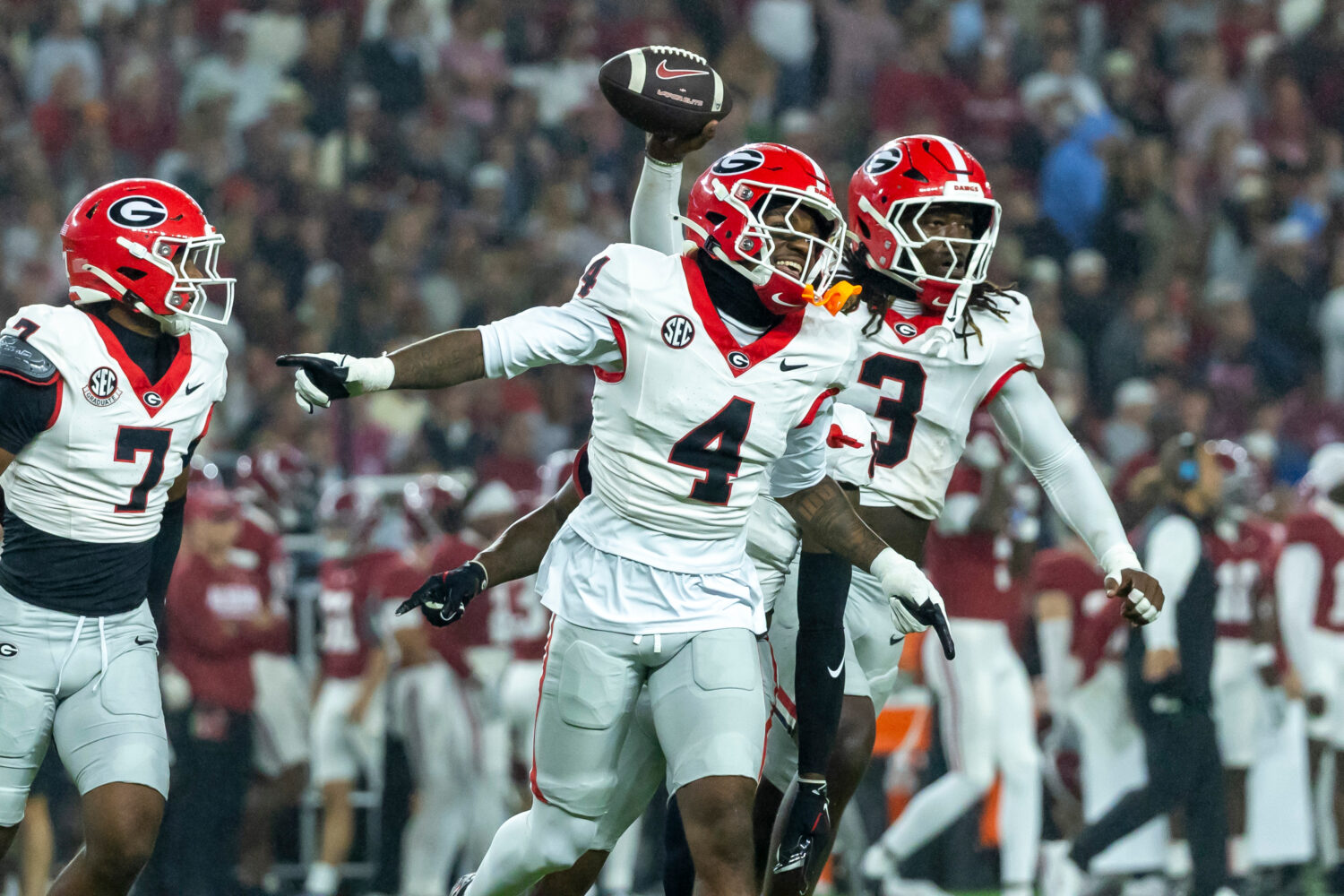 Georgia defensive back KJ Bolden (4) and linebacker Quintavius Johnson (3) celebrate after Johnson'...