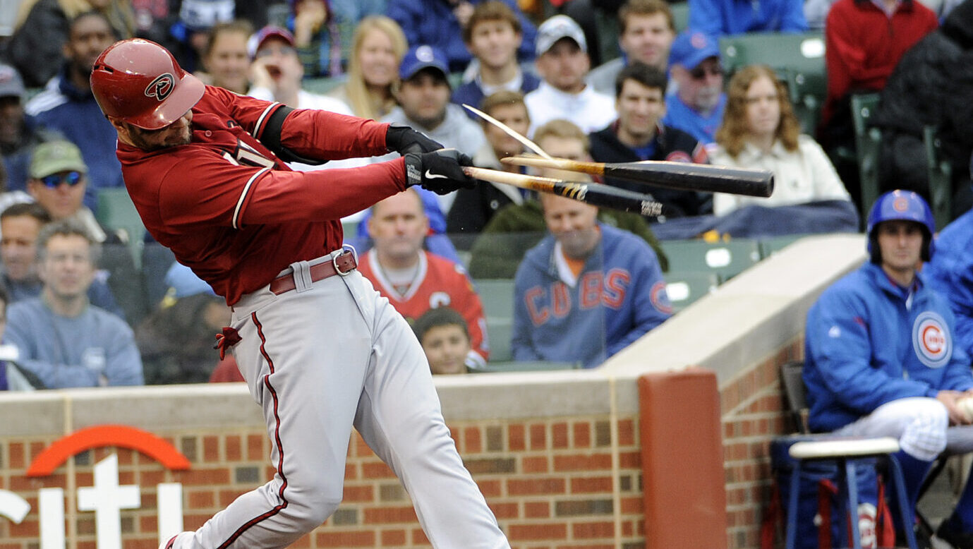 Cody Ross of the Arizona Diamondbacks breaks his bat during a game against the Chicago Cubs at Wrig...