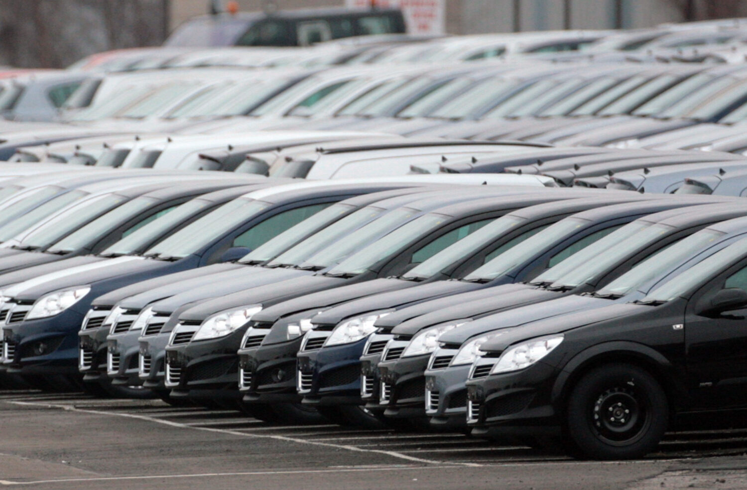 ELLESMERE PORT, ENGLAND - FEBRUARY 18: Vauxhall motor cars sit in the distribution yard at the comp...