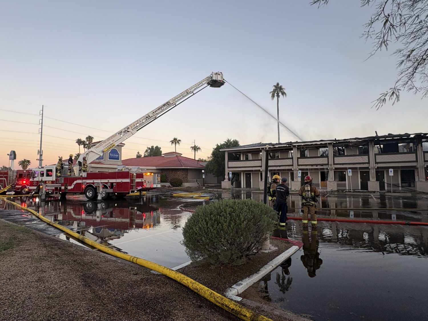 A fire burned through a vacant motel near 25th Avenue and Greenway Road in north Phoenix early Frid...