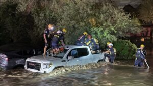 Crews rescue 6 people trapped after 4 cars get stuck following heavy rain in Phoenix