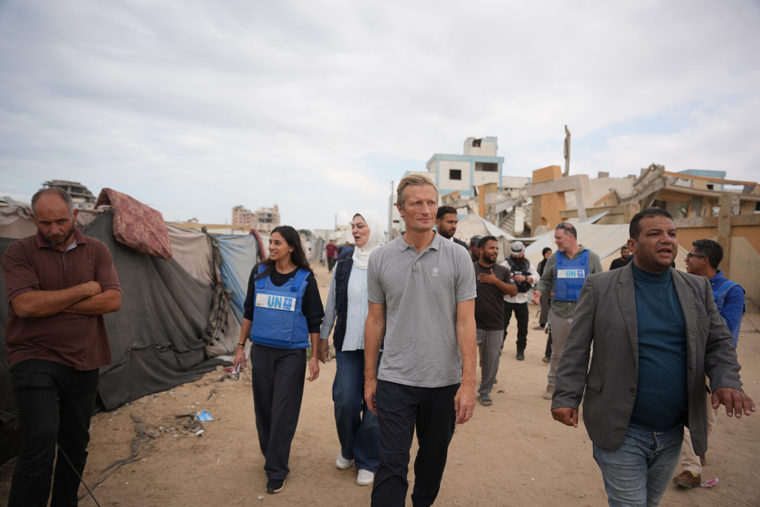 World Food Programme Executive Director Carl Skau, center, visits a camp for displaced Palestinians...
