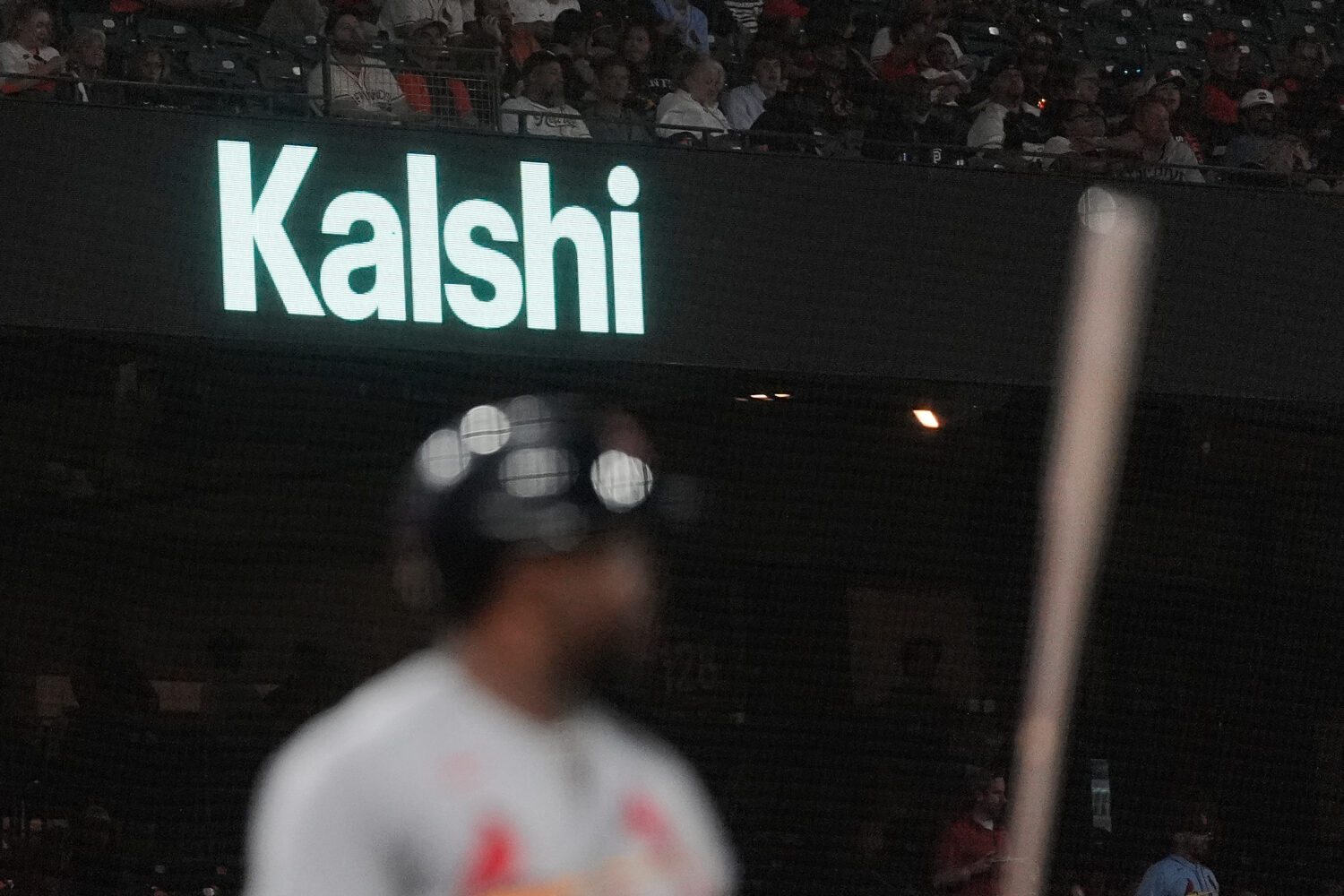 FILE - A Kalshi advertisement is displayed at Oracle Park during a baseball game between the San Fr...
