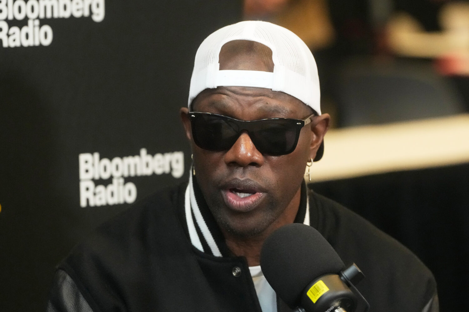 FILE - Former NFL football player Terrell Owens speaks at the NFL's Super Bowl Radio Row in San Fra...