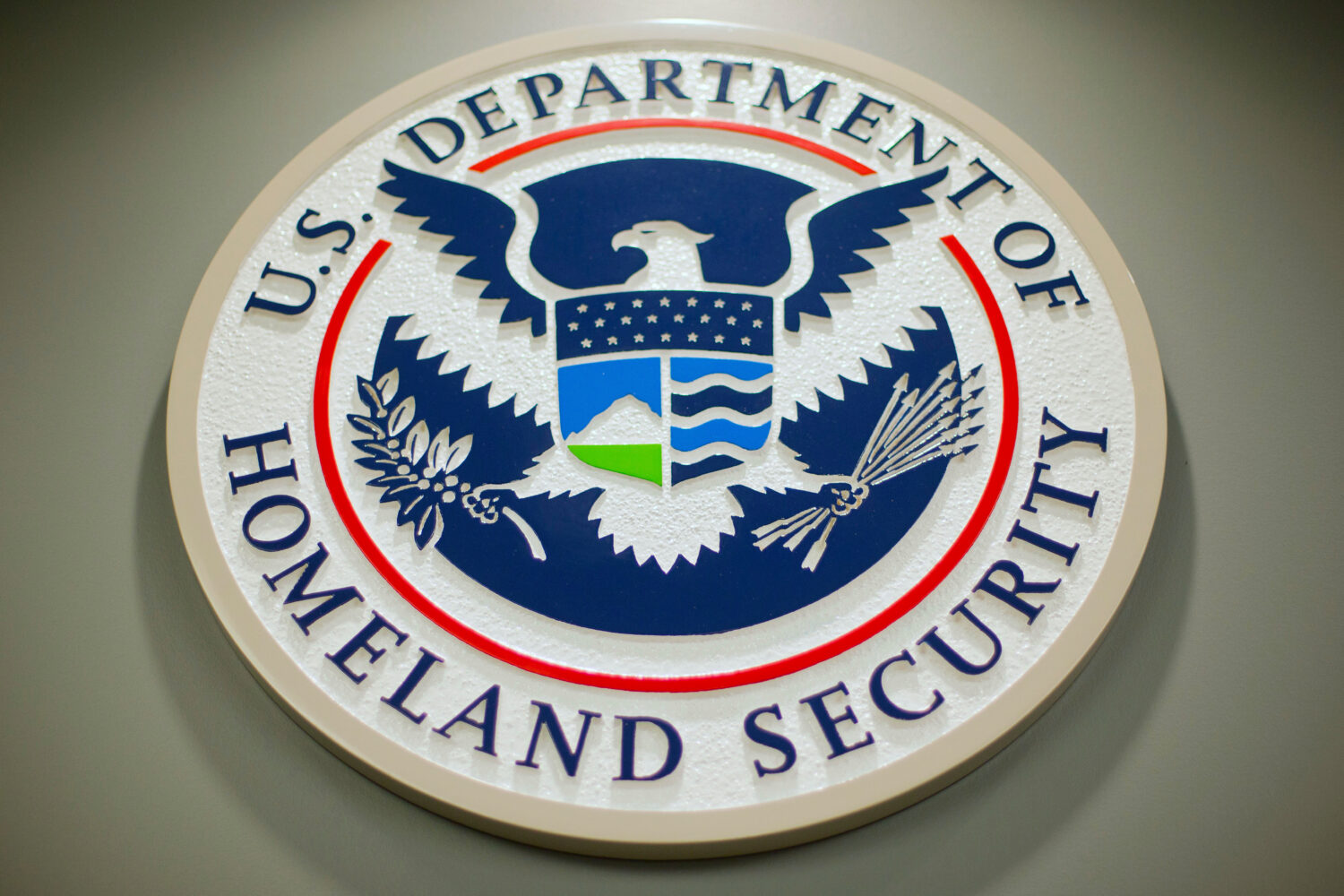 FILE - The Department of Homeland Security logo is displayed during a news conference in Washington...