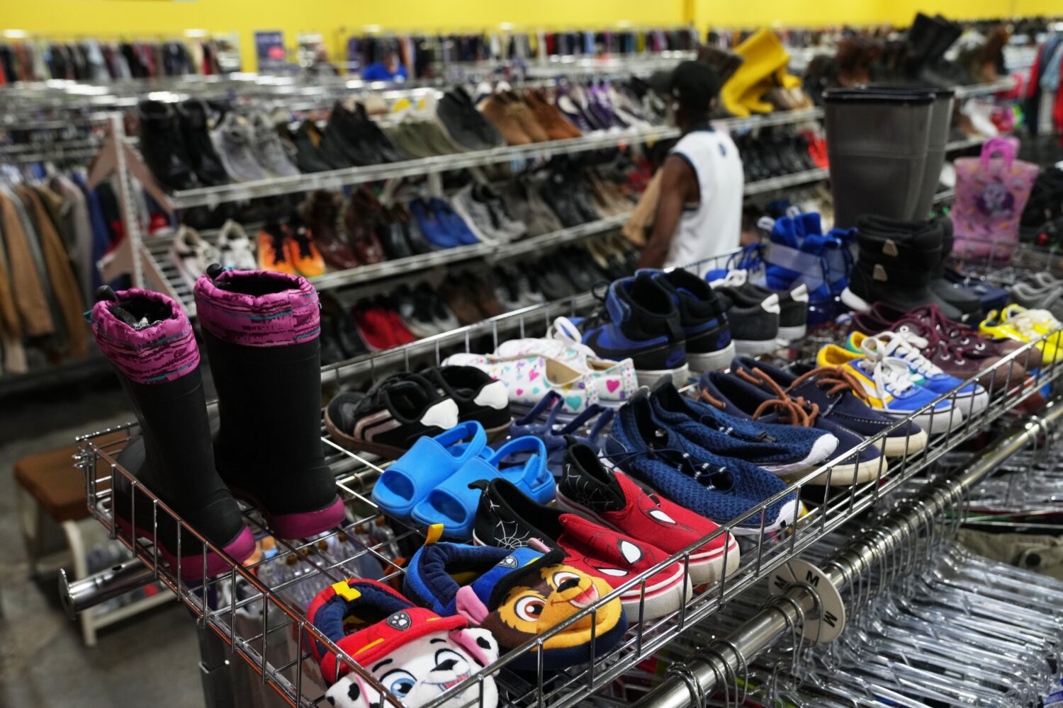 FILE - The children's shoe section is seen at a Goodwill store in Roseville, Minn., Aug. 12, 2026. ...