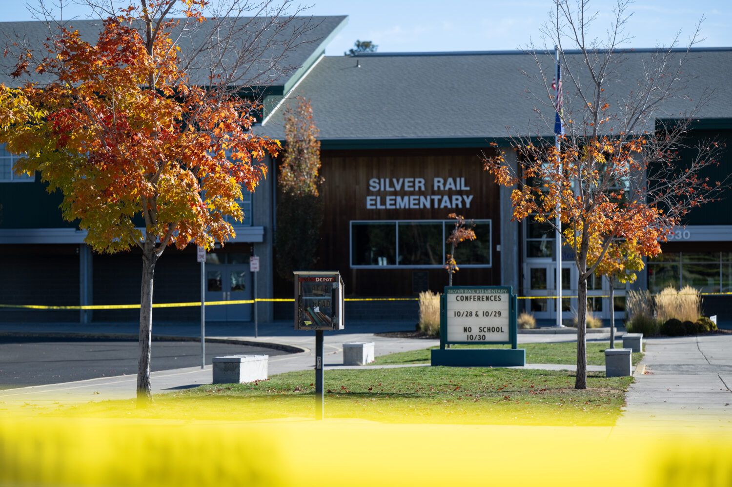 Police caution tape surrounds Silver Rail Elementary in Bend, Ore., Friday, Oct. 16, 2026, a day af...