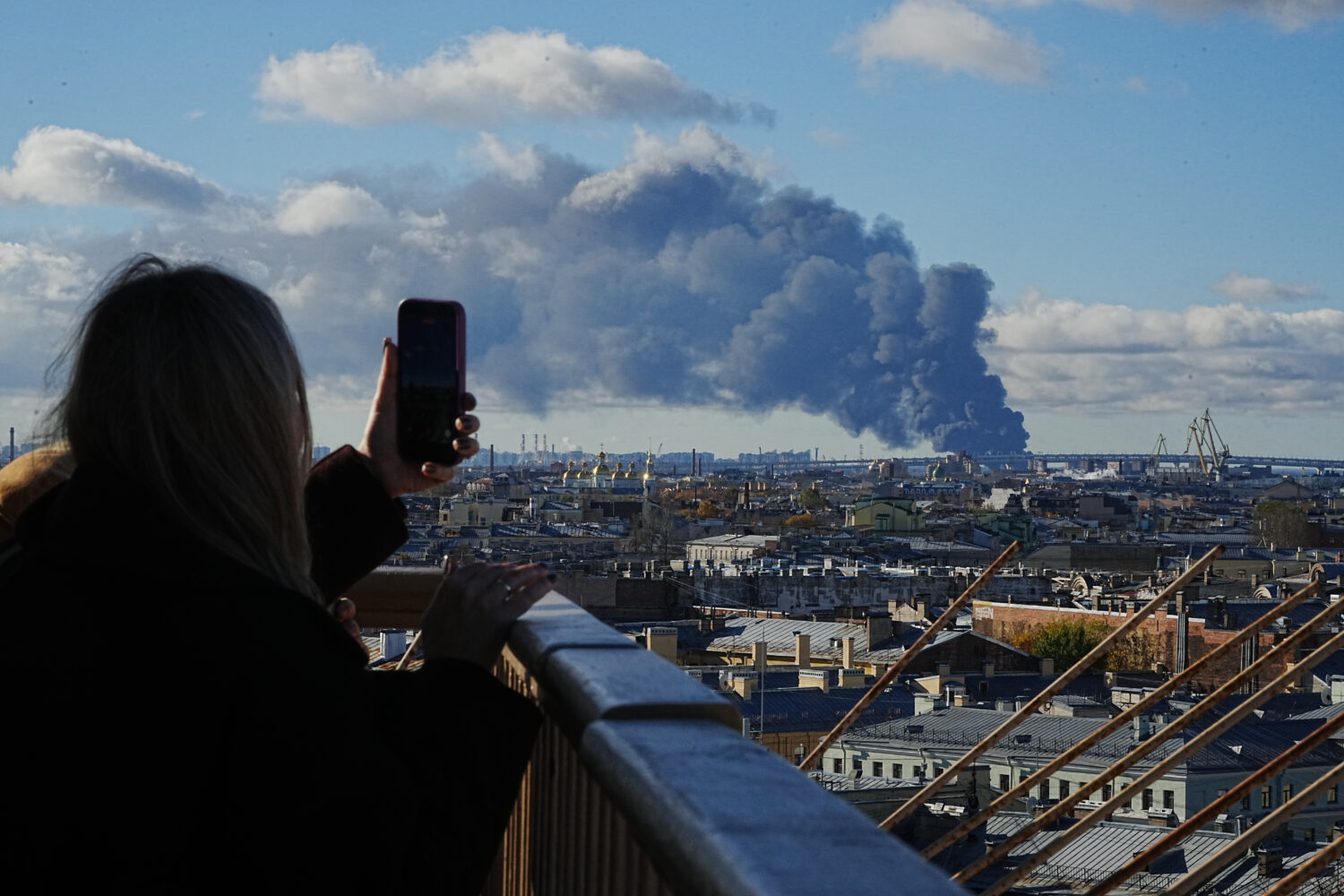 Smoke billows into the sky following Ukrainian drone strikes on an industrial zone in St. Petersbur...