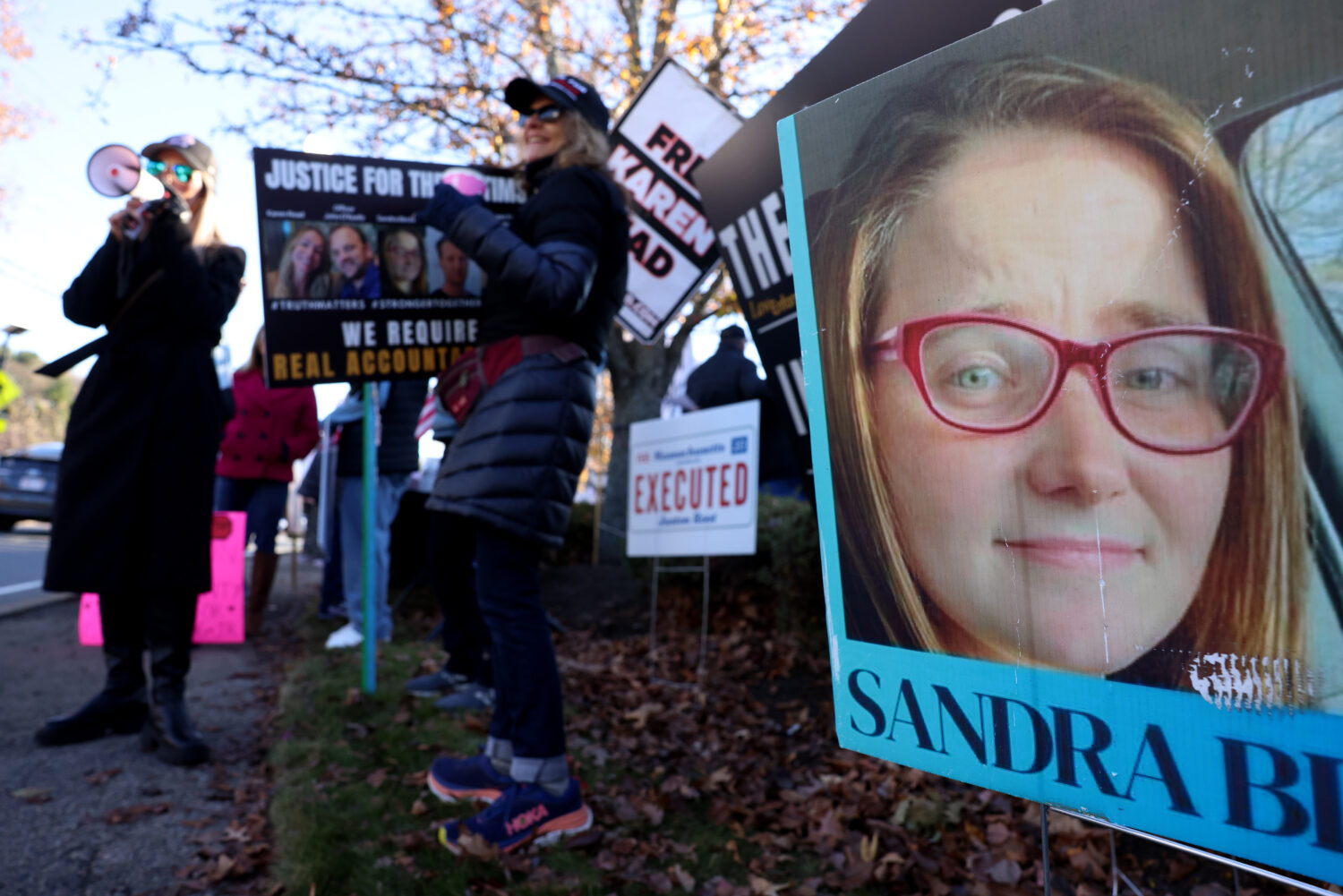 A photo of Sandra Birchmore is displayed during a Stronger Together Standout gathering, where the g...