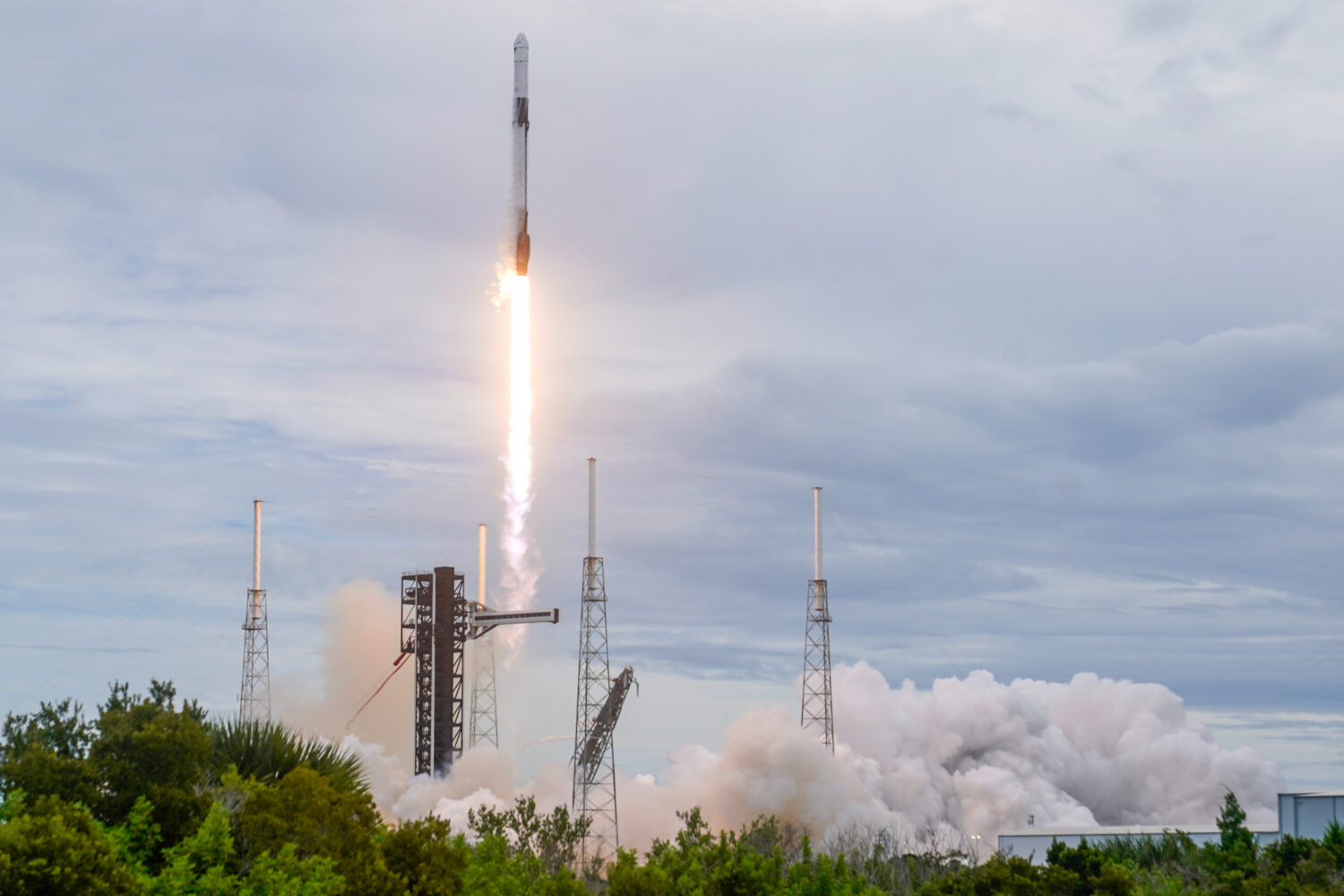 A SpaceX Falcon 9 rocket with a crew of four launches from pad 40 at the Cape Canaveral Space Force...