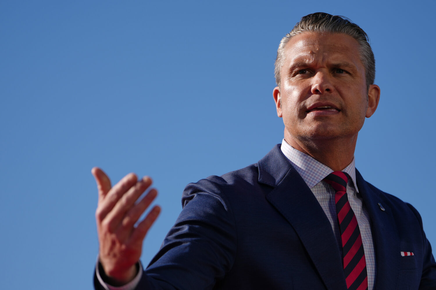 Defense Secretary Pete Hegseth speaks before President Donald Trump at an event for Anduril Industr...