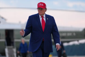 Trump puts new Russia sanctions passed by Congress on hold, saying waiver is in US national interest