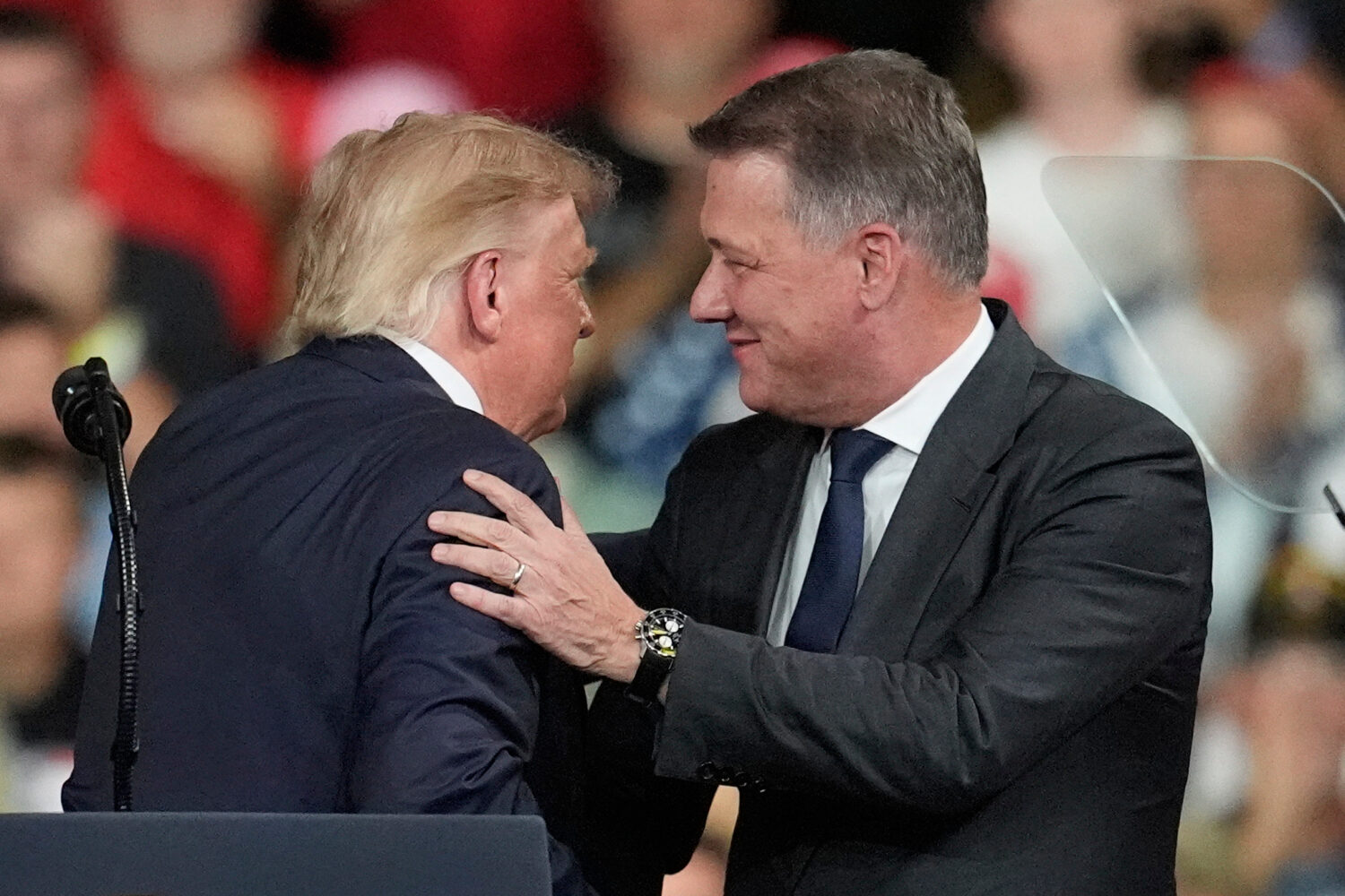 President Donald Trump greets Gernot Döllner, CEO of Audi AG, at a campaign rally at Guardian Cent...