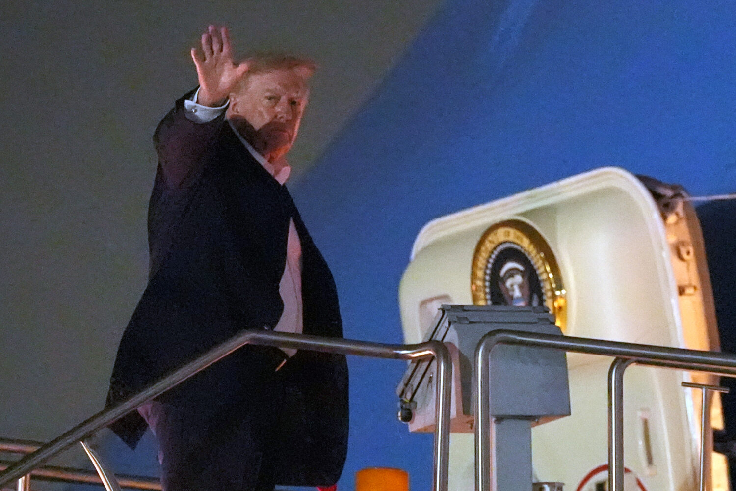 President Donald Trump boards Air Force One at Dallas Fort Worth International Airport, Thursday, O...