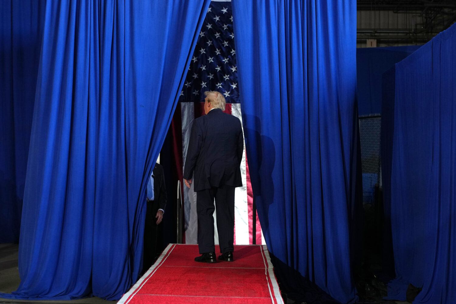 President Donald Trump walks from the state after speaking at a campaign rally at the Port of Corpu...