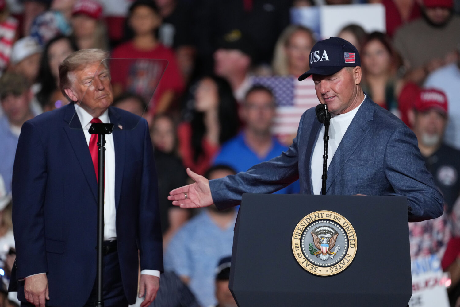 President Donald Trump listens as Roger Clemens speaks at a campaign rally at the Freeman Coliseum ...