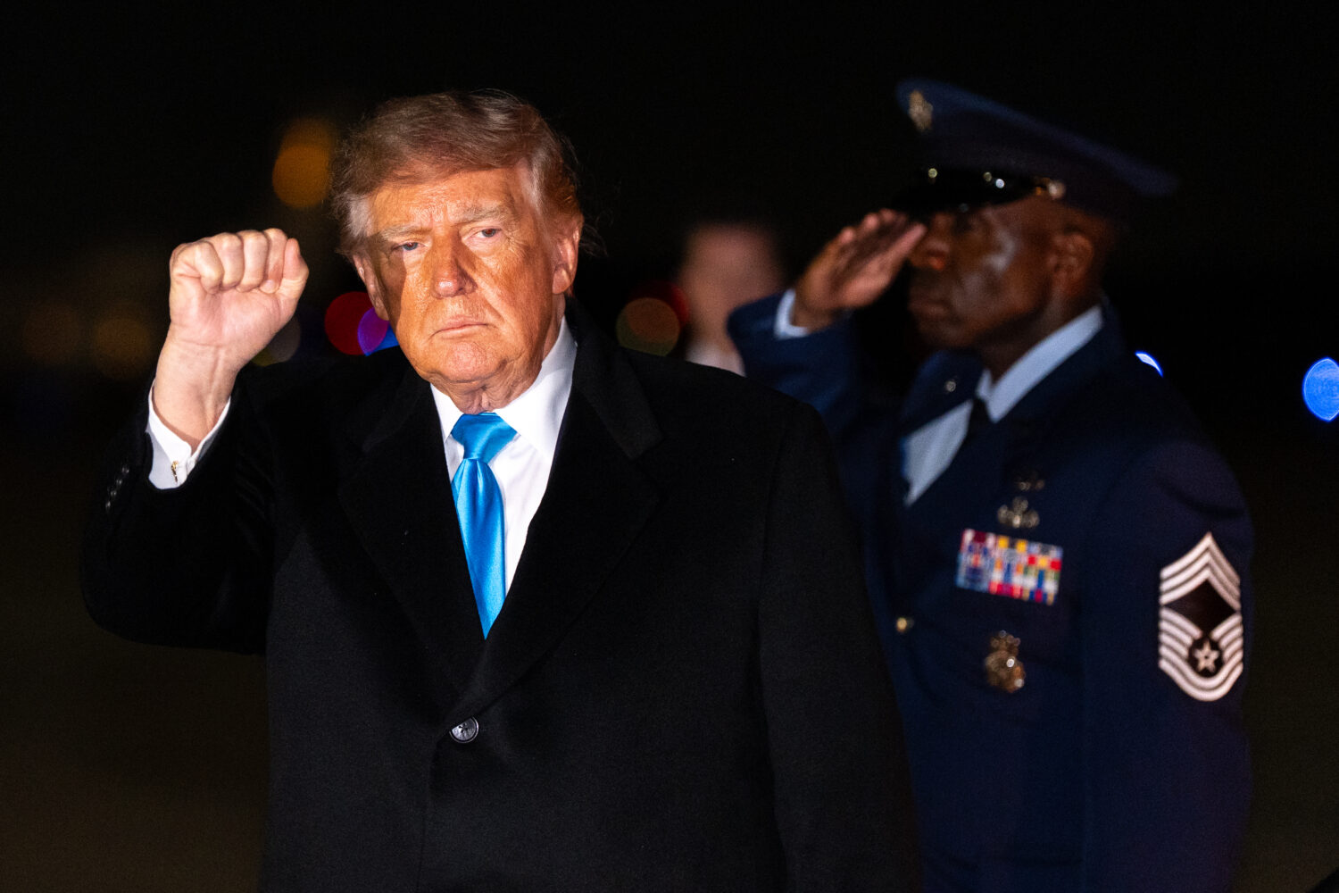 President Donald Trump pumps his fist as he arrives on Air Force One, Monday, Oct. 5, 2026, at Join...