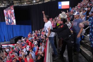 Trump interrupted by protesters as he fights to rally Texas voters behind Paxton in US Senate race