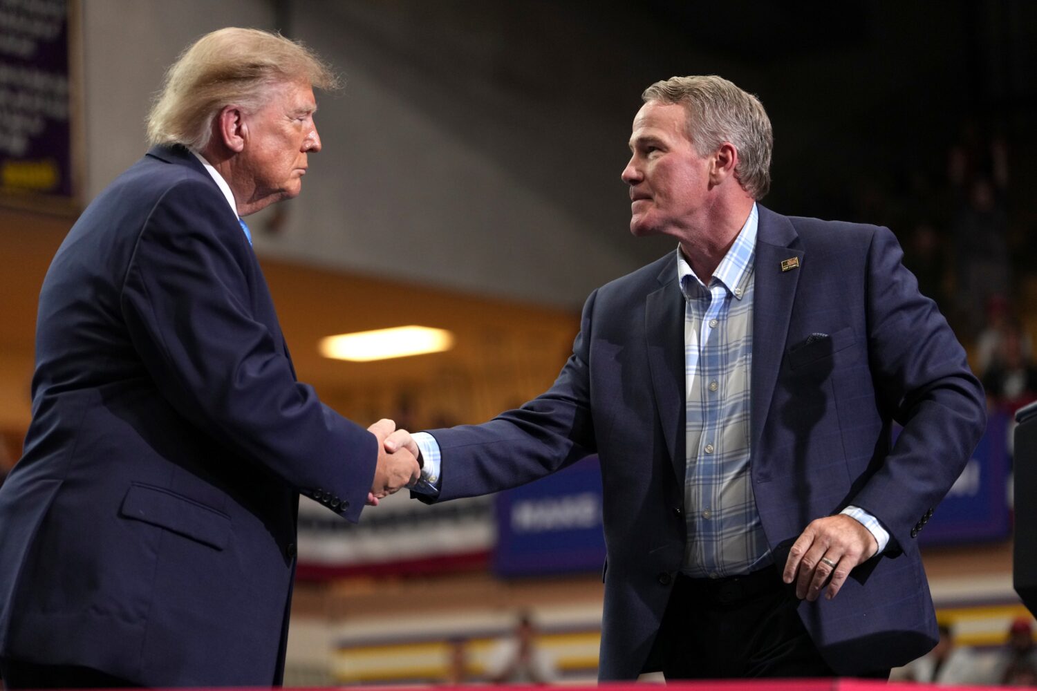 Sen. Jon Husted, R-Ohio, right, shakes the hand of President Donald Trump after speaking during an ...
