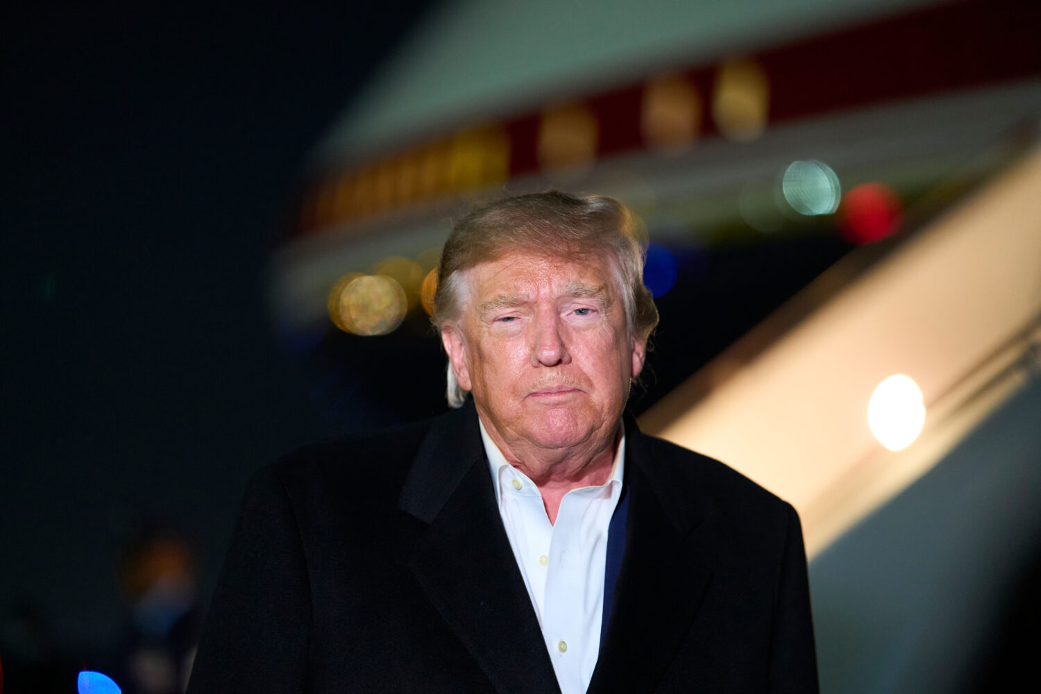 President Donald Trump speaks with reporters as he arrives on Air Force One, Wednesday, Oct. 28, 20...