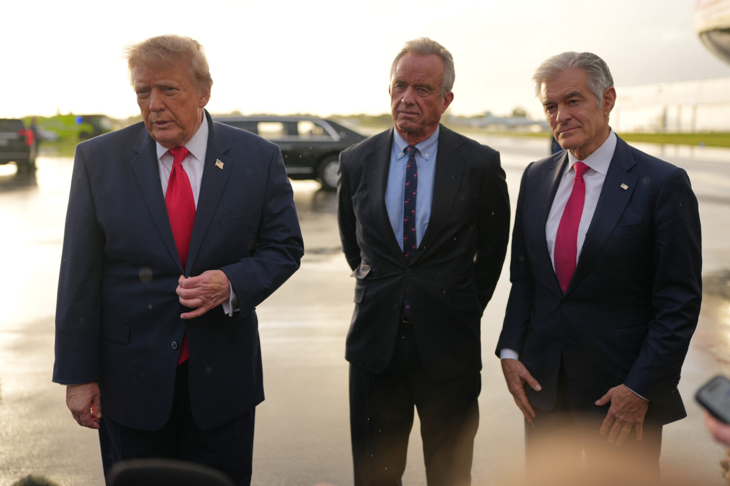President Donald Trump talks with reporters after arriving on Air Force One, Friday, Oct. 23, 2026,...