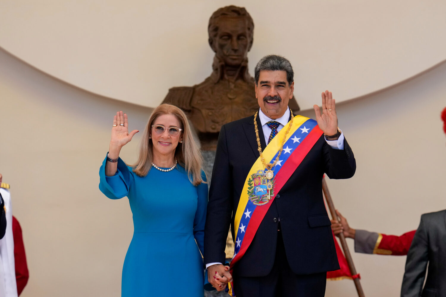FILE - Venezuelan President Nicolas Maduro and his wife Cilia Flores wave after his swearing-in cer...